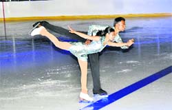 Two skaters perform
