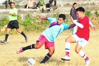 A match in the Great Vivekanand Memorial Football Tournament under way in Dehradun on Monday. 