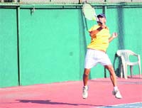 A player in action at the All-India Talent Series Tennis Tournament in Dehradun on Monday. 