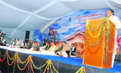 Chief Minister Ramesh Pokhriyal Nishank addresses the national tribal convention held at Jhajra near Dehradun