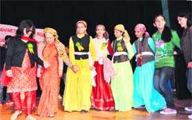 Congress leader Vidya Stokes (second from left) along with girls of the Kotkhai Student Association dances at Kalibari Hall in Shimla on Monday.