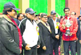 Haryana Chief Minister Bhupinder Singh Hooda (L) with National Badminton Championship winner Arvind Bhatt in Rohtak