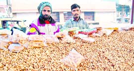 Vendors sell groundnuts in Amritsar.