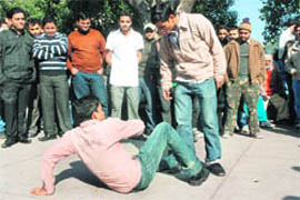 Artistes from the Chandigarh Art Theatre perform a street play ‘Main Nashe Me Hu’ at the Sector 17 Plaza in Chandigarh