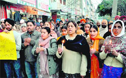 Residents of Burail village take part in a candle march to pay tributes to Khushpreet at Sector 45 in Chandigarh
