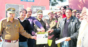 Head Constable Rajesh Kumar administers oath against consumption of alcohol to GRP personnel at Sirsa on Tuesday.