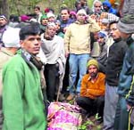 Villagers with the body of Shanti Devi, who was mauled by the tigress.