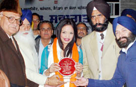 Canadian MP Ruby Dhalla being honoured by Barjinder Singh Brar, president, Municipal Council, senior Akali leader Jathedar Tota Singh and local residents at Moga on Wednesday.