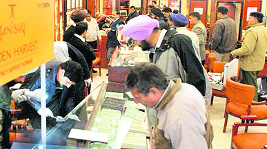 Forensic experts lift fingerprints from the Tanishq showroom at Mani Majra in Chandigarh on Wednesday.