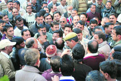 BJP and Congress workers scuffle in Hamirpur on Wednesday. 