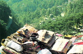 A worker takes a nap in the sun in Shimla on Wednesday.