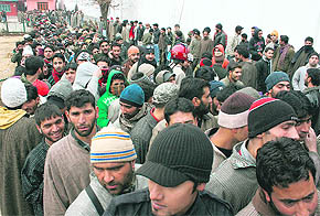 Youths line up for recruitment to the police in Srinagar on Wednesday.