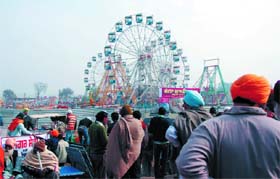 Ferris wheels make for a spectacular sight at the Maghi Mela venue in Muktsar
