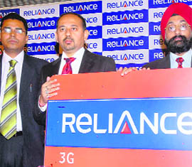 Reliance Communications Punjab head Sabyashchi Chakraborty (C) at the launch of 3G services in Jalandhar on Thursday.