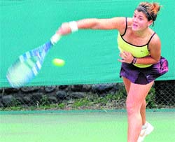 A tennis player returns a shot during the ITF match at the CLTA, Sector 10, Chandigarh, on Thursday.