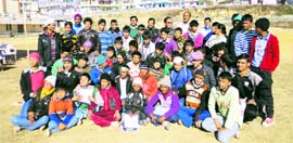 Tribal students pose after participating in a sports camp in Pithoragarh on Wednesday.