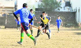 A match in the District Hockey Tournament under way in Dehradun on Thursday.