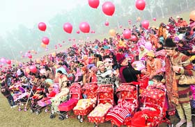 Women with their babies before the start of a pram walk organised by NIFAA in Karnal