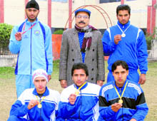 The winning tae kwon do team of Markanda National College, Shahabad, with principal Vinay Kumar Malhotra
