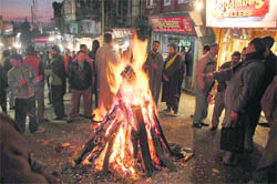 People celebrate Lohri at the Lower Bazaar in Shimla.