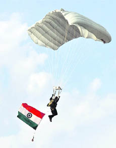 A soldier shows his parajumping skills during an Army fair in Jammu on Thursday. 