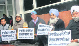 Members of the RTI Activists Federation sit on a dharna in Jalandhar. 