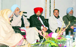 Dr Gursharan Singh addresses the gathering at Gian Sagar