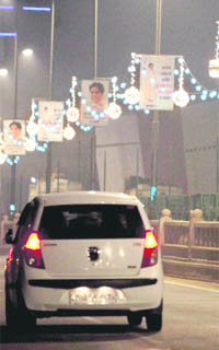 Uttar Pradesh Chief Minister Mayawatis pictures don a road ahead of her birthday (on Jan 15) in Gomti Nagar area of Lucknow on Thursday.