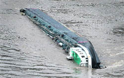 The ship loaded with 2,400 tonne of acid that capsized in Rhine, near St Goarshausen, on Thursday. 
