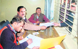 Candidates buy forms for the zila panchayat elections at the District Panchayat Office in Haridwar 