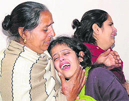 The aggrieved family members of Bhem Sen Sachdeva in Karnal on Friday. Tribune photo: Ravi Kumar