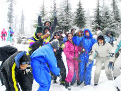 Tourists enjoy a fresh spell of snow near the Solang valley