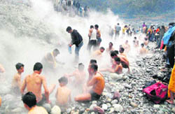 Devotees take a holy dip in the Sutlej at Tatapani, 52 km from Shimla,