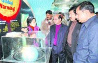 Additional District Development Commissioner, Udhampur, Ram Rattan Sharma, looks at an exhibition in the Science Express in Udhampur on Friday.