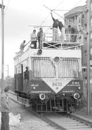 Railway officials lower electric wires for the construction of railway overbridge on the Zirakpur-Kalka highway