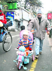 A father-son duo take a stroll in Mussoorie