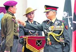 (Right) Lt-Gen KT Parnaik, GOC-in-C Northern Command, presents a unit citation during the investiture ceremony held at the Sangha Auditorium at Akhnoor on Army Day 