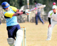 A batsman of the Sri Lankan Port Authority team pulls a delivery in the Shyam Dutt Memorial Cricket Tournament in Dehradun on Sunday