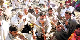 Protesters squat on the rail track near Julani village in Jind.