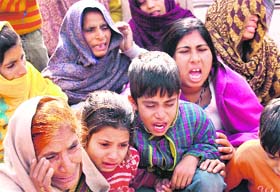 Grieving members of the family of Vijay Kumar, who died allegedly in police custody at Janipur in Jammu