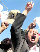 Students in Sanaa shout slogans during a demonstration in support of the ouster of Tunisia's President on Sunday