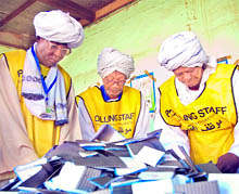 Sudanese polling staff sorting votes for counting at the Armed Forces Club voting centre in the northern Darfur capital of El-Fasher at the end of a week-long south Sudan independence referendum on Saturday