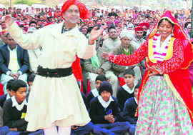 Artists present a cultural dance during the inauguration function of a power project at Boh-Dharini, 35 km from Dharamsala, on Monday.