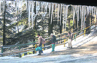 Icicles hang from a roof in Shimla on Monday.