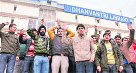 Activists of the National Secular Forum hold a demonstration in front of Central Library in Jammu on Monday.