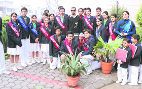 Cricketer Love Ablish (wearing black goggles) with students of Ryan International School in Ludhiana on Monday. 