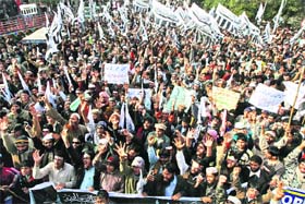 Supporters of Pakistani religious parties raise slogans against recent statements by Pope Benedict XVI on blasphemy laws at a rally in Lahore