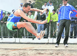 An athlete attempts a long jump during the XXXI PSPB Athletics Meet at Tau Devi Lal Sports Complex, Sector 3, Panchkula, on Tuesday