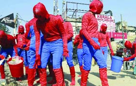  People dressed up a spiderman take part in a cleanliness and road safety drive at INA Market in New Delhi on Tuesday. The drive @@was organised by UTV.