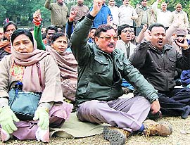 Ministerial employees protest in Dehradun on Monday. A Tribune photograph